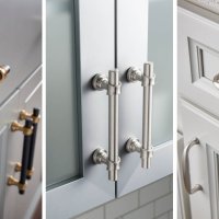Close-up view of cabinet drawers with modern gray and brass hardware and fixtures