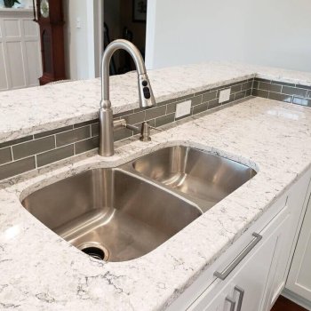 Fresh countertops with undermount kitchen sink and accessible outlets