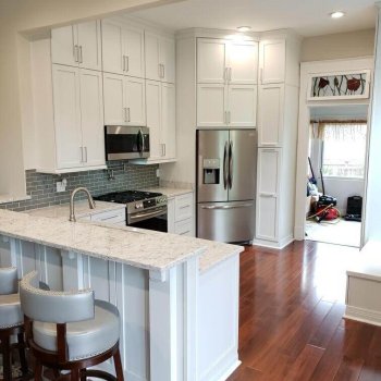 Floor to ceiling kitchen with peninsula bar