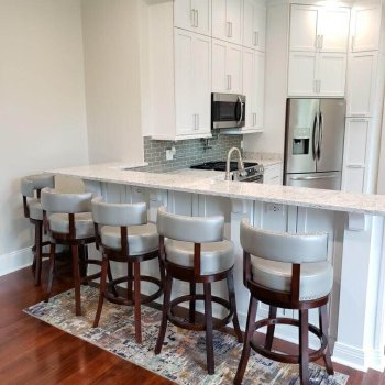 Floor to ceiling kitchen with peninsula bar